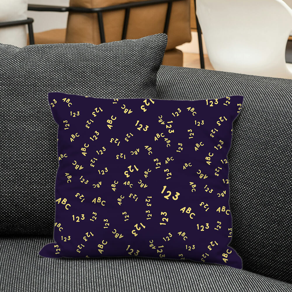 Cushion with ABC and 123 yellow doodles on dark purple base, adding smart and fun touch to kids space or learning room.