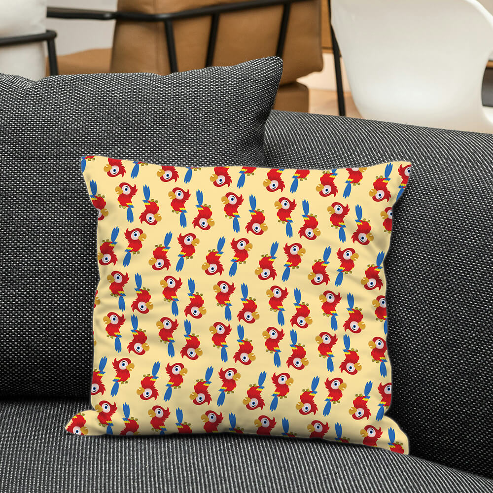Red and blue macaw birds on a soft cream cushion, bringing playful color and animal charm to nursery or kids space.