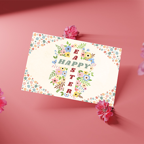 Pastel floral Easter card with a blossom cross and soft spring colors creating a warm and cheerful seasonal greeting.