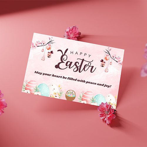 Soft pastel Easter card with blossoms, hanging eggs, spring florals and warm Happy Easter text for gentle seasonal greeting.