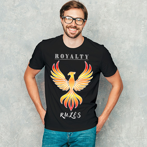 Man wearing a black T shirt with orange phoenix Royalty Rules design, posing casually with hands in pockets.