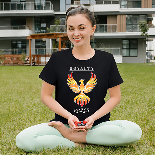 Phoenix graphic T-shirt design with rising wings and rich royal tones, symbolizing calm power, renewal and balanced strength.
