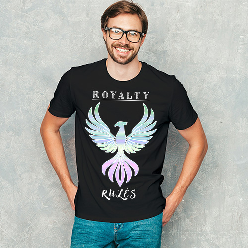 Man wearing a black T-shirt with a colorful phoenix graphic and Royalty Rules text, smiling confidently outdoors.