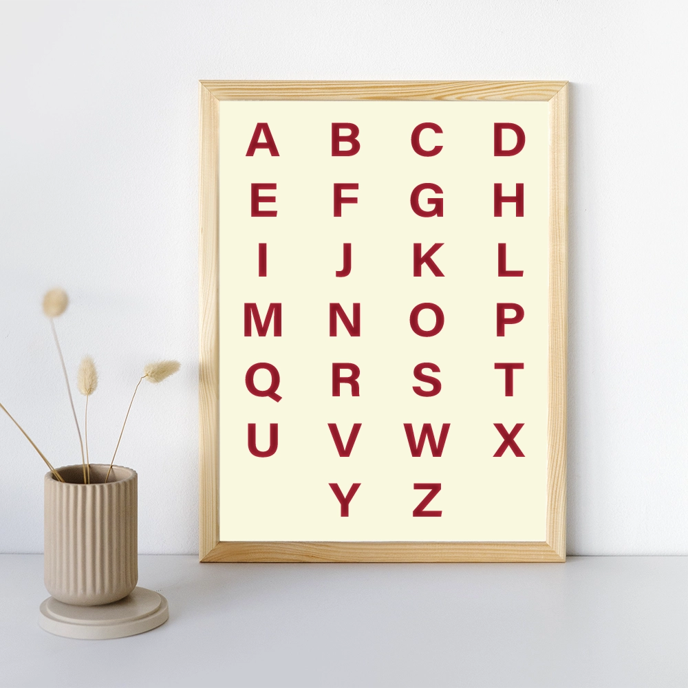 ABC Wall Chart Printable with bold red alphabet letters on soft beige background in wooden frame for kids room decor